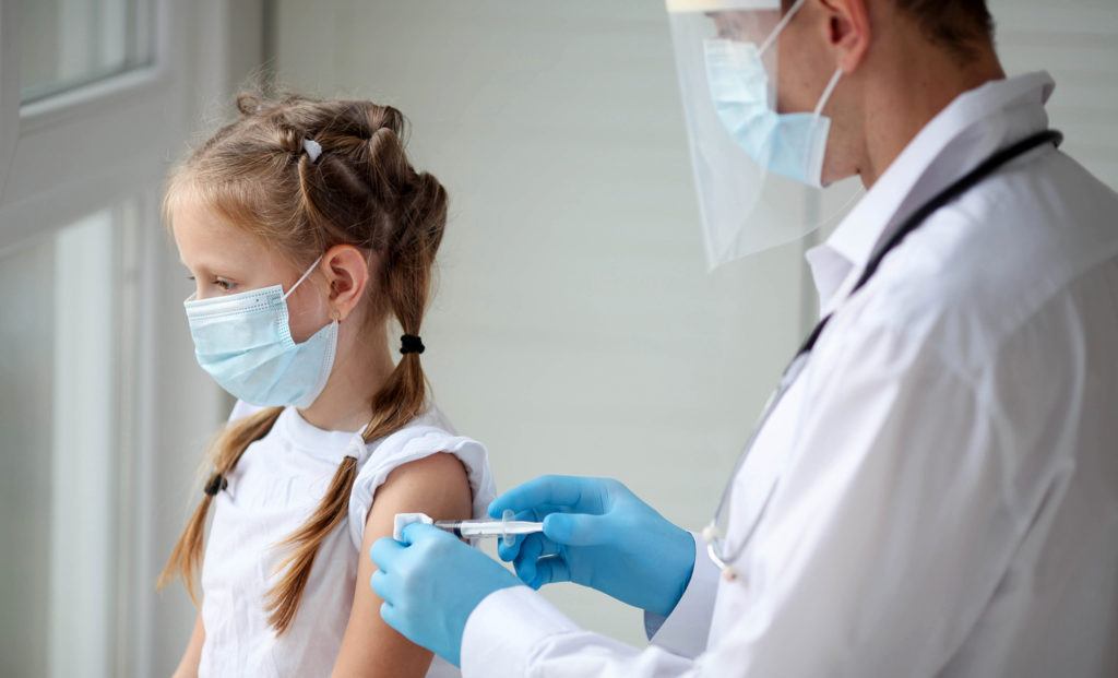 vaccine shot in child's arm